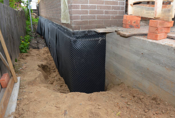 SJ Waterproofing Pros technician performing targeted Exterior Waterproofing assessment in Martinsburg, PA